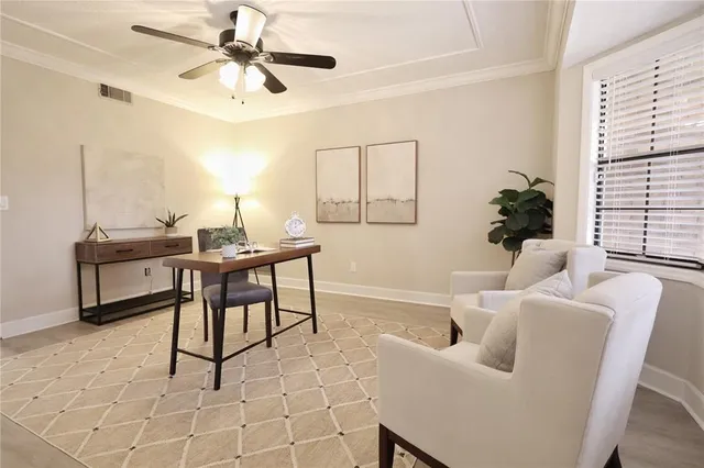 a work room with furniture and windows