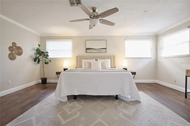 a bathroom with a granite countertop sink a mirror and a shower