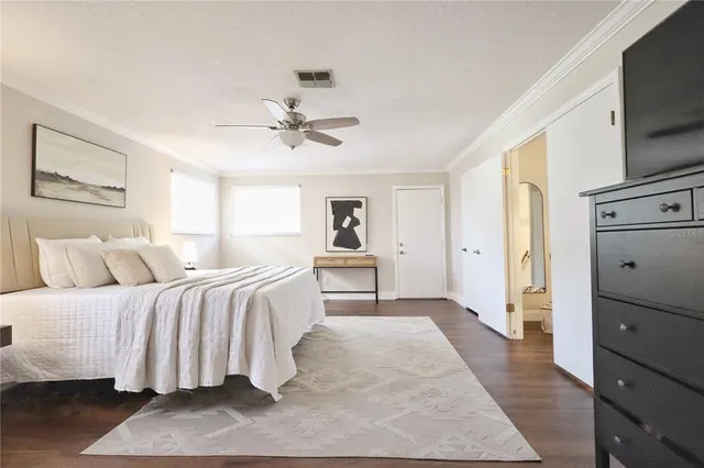 a white toilet sitting next to a bath tub shower