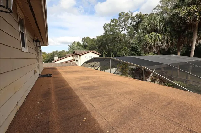a bedroom with bed and wooden floor