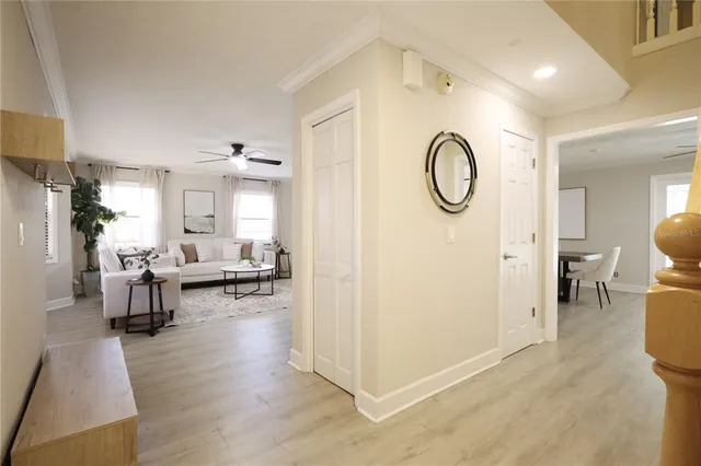 a living room with furniture flat screen tv and window