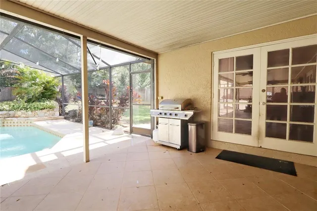 a view of a backyard with a patio and a yard