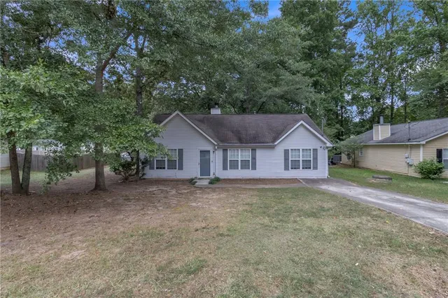a house with trees in the background