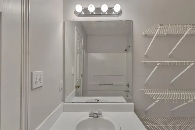 a bathroom with a bathtub and shower