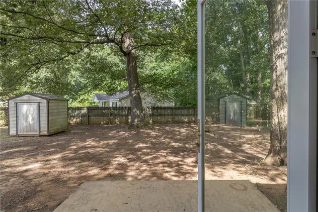 a backyard of a house with lots of green space