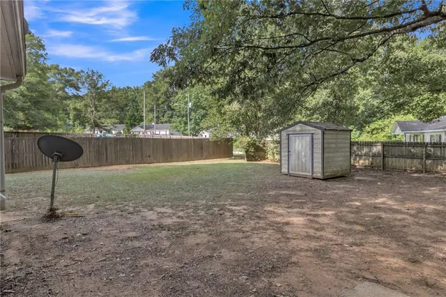 a backyard of a house with lots of green space