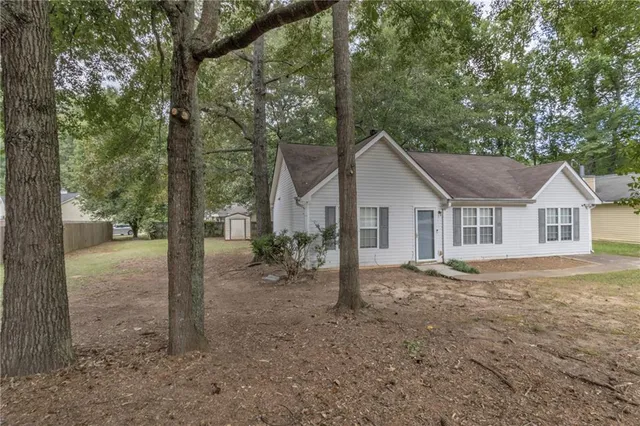 a house with trees in the background