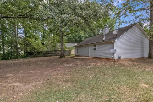 a backyard of a house with lots of green space