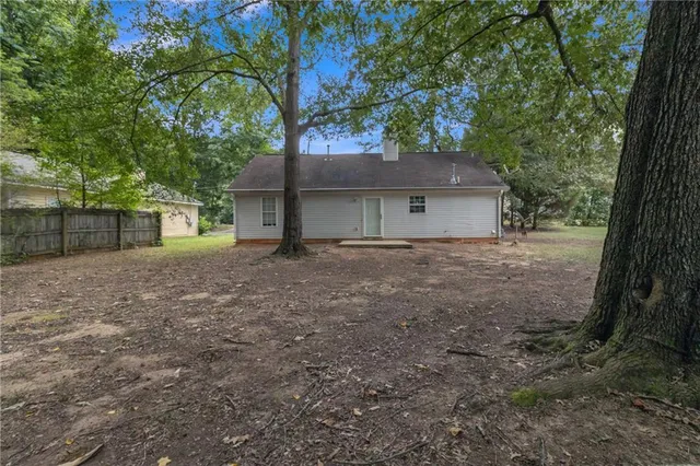a house with a tree in front of it