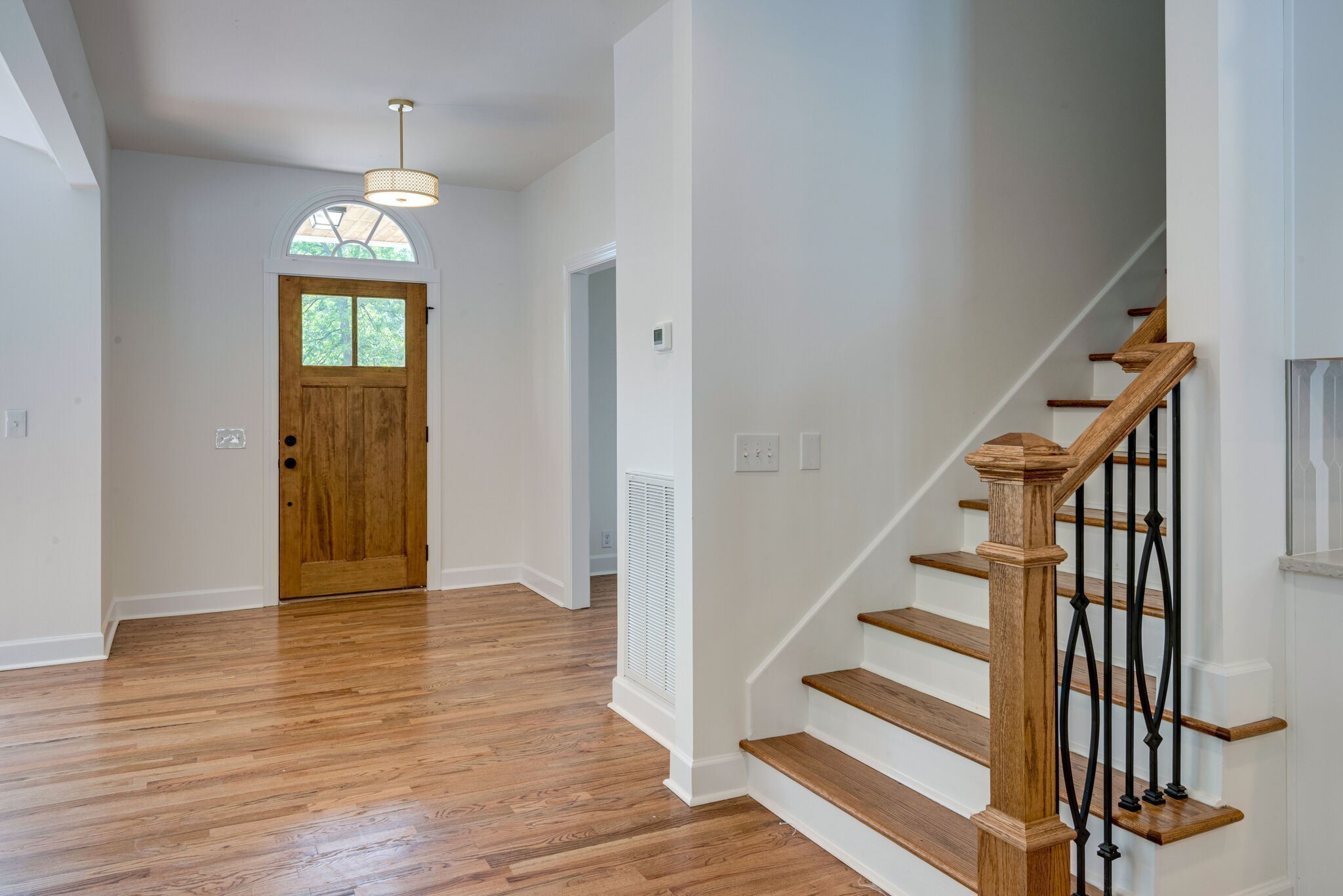325 East Piney Road Dickson, TN 37055 - Photo 17 of 63 wooden floor in an empty room with wooden floor and stairs