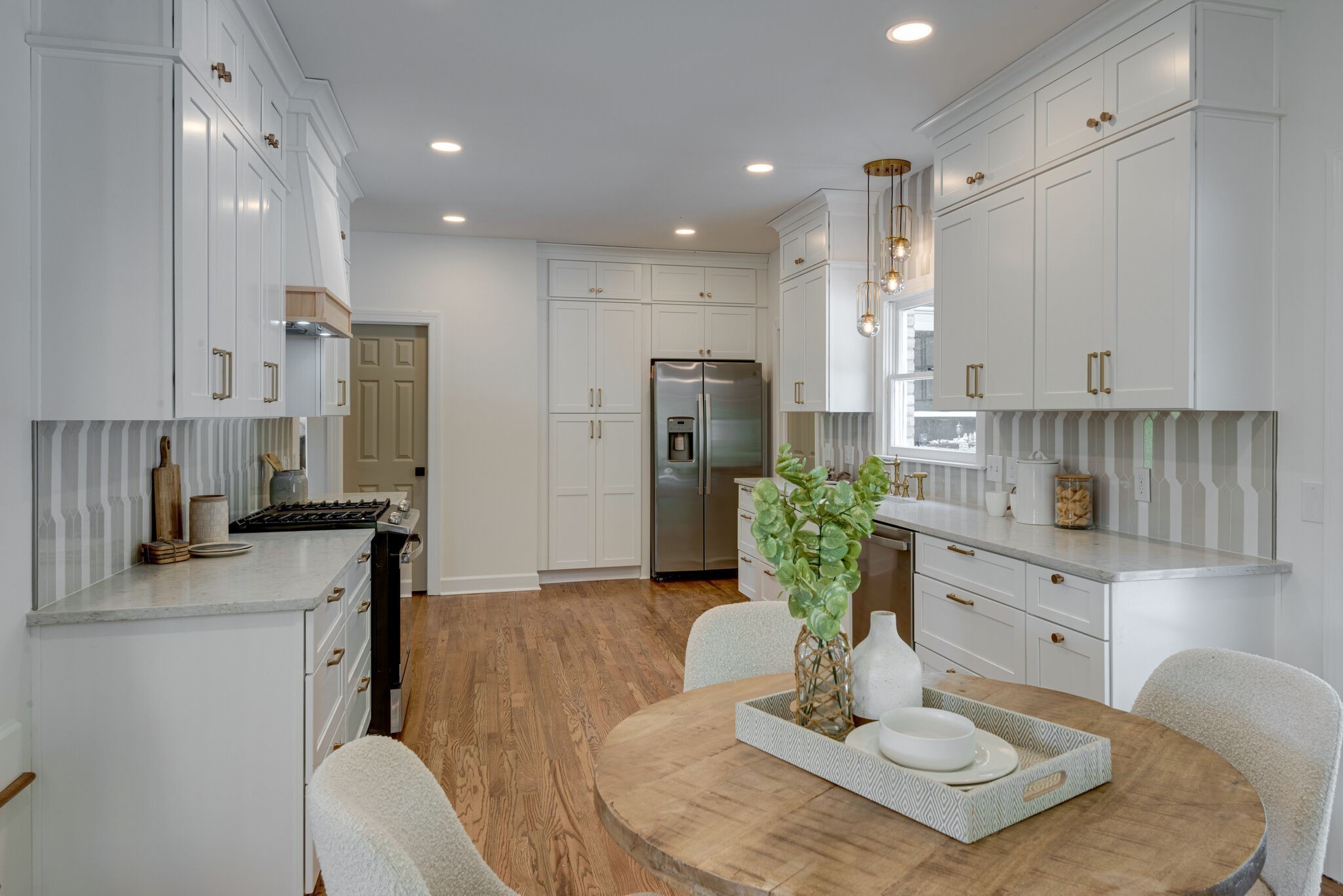 325 East Piney Road Dickson, TN 37055 - Photo 23 of 63 a kitchen with stainless steel appliances granite countertop a refrigerator a stove a sink dishwasher and white cabinets with wooden floor