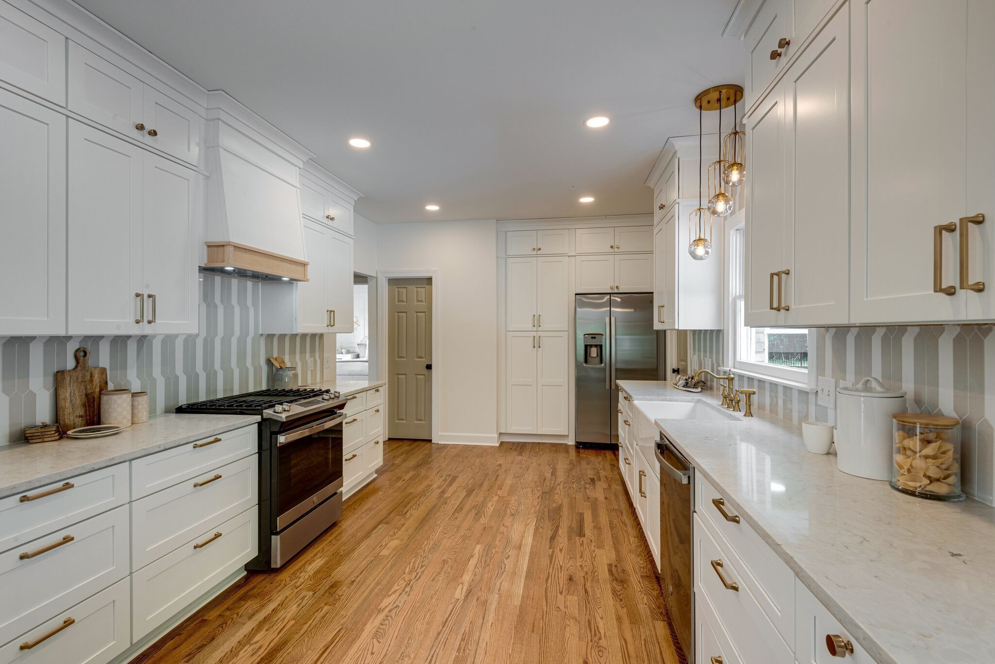 325 East Piney Road Dickson, TN 37055 - Photo 24 of 63 a large kitchen with stainless steel appliances lots of counter space and wooden floor