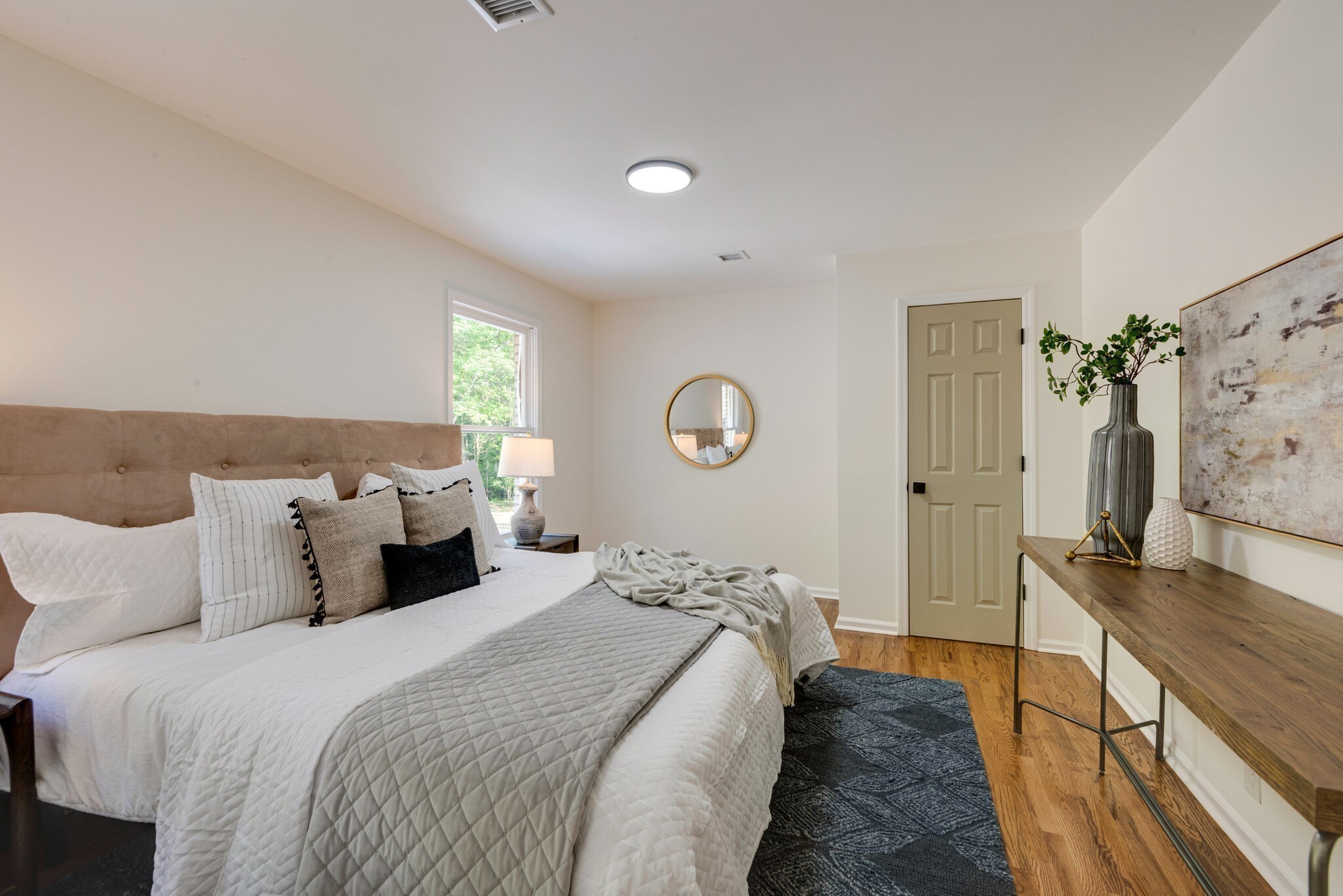 325 East Piney Road Dickson, TN 37055 - Photo 40 of 63 a bed room with a bed and a flat tv screen on dresser