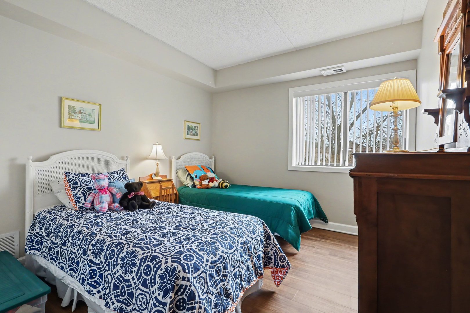 1423 Woodbridge Road, Unit 1E Joliet, IL 60436 - Photo 16 of 30 a bedroom with a bed and a table in it