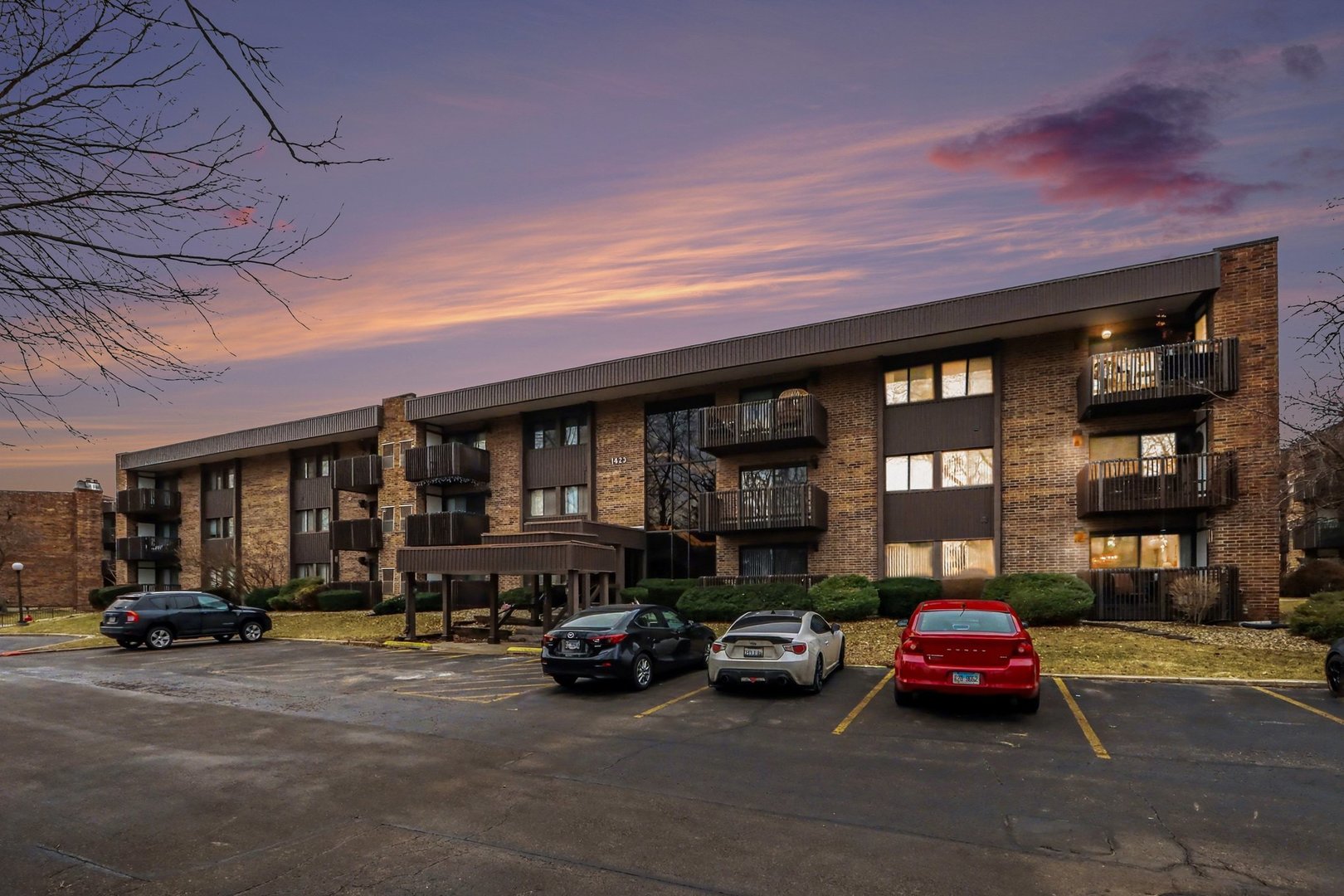1423 Woodbridge Road, Unit 1E Joliet, IL 60436 - Photo 2 of 30 a car parked in front of a building