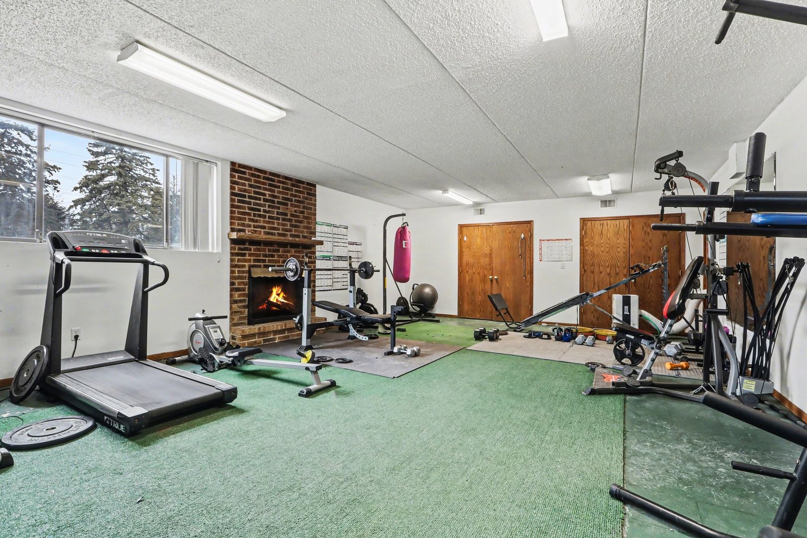 1423 Woodbridge Road, Unit 1E Joliet, IL 60436 - Photo 24 of 30 a view of a room with gym equipment