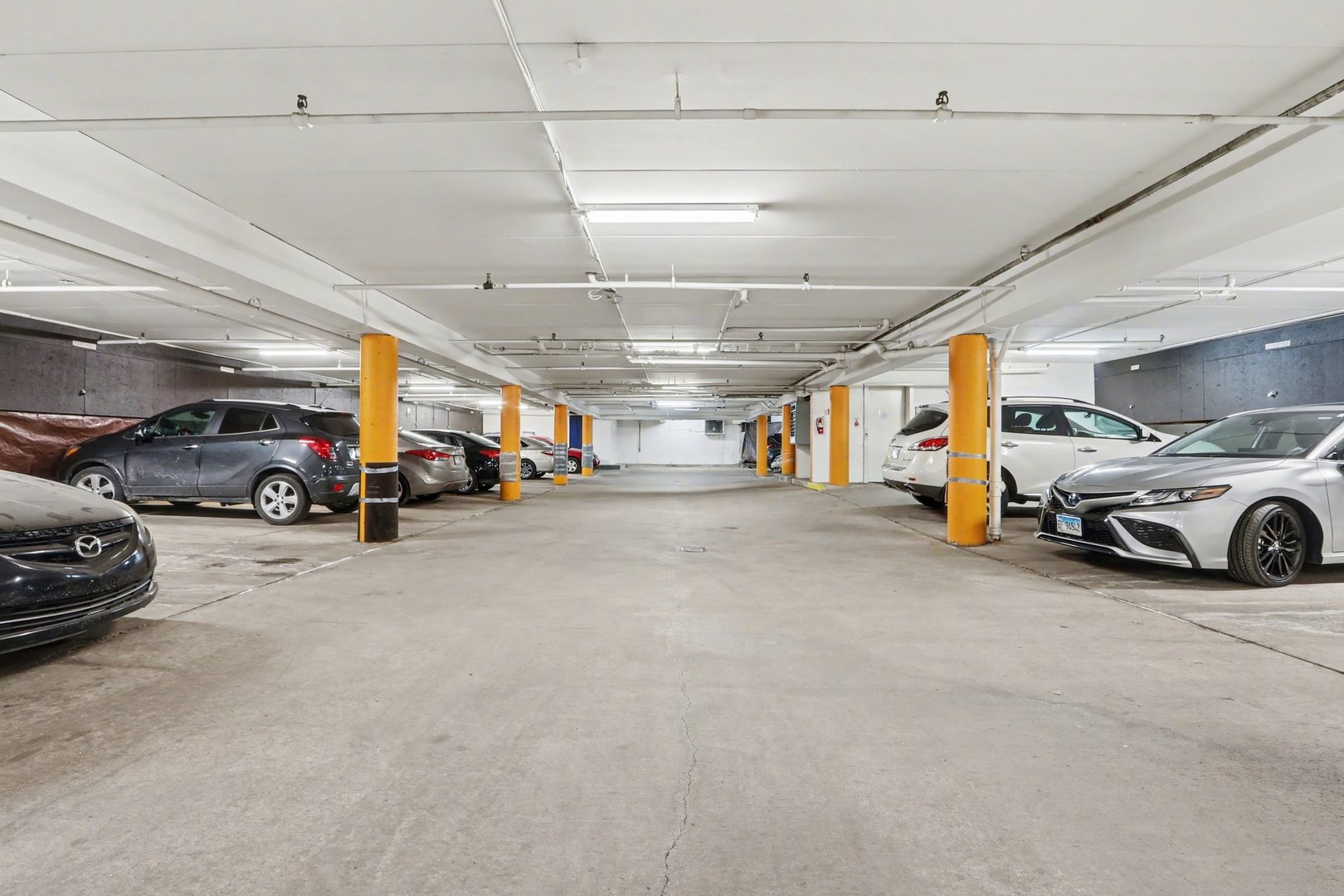 1423 Woodbridge Road, Unit 1E Joliet, IL 60436 - Photo 25 of 30 a view of parking area with parked cars