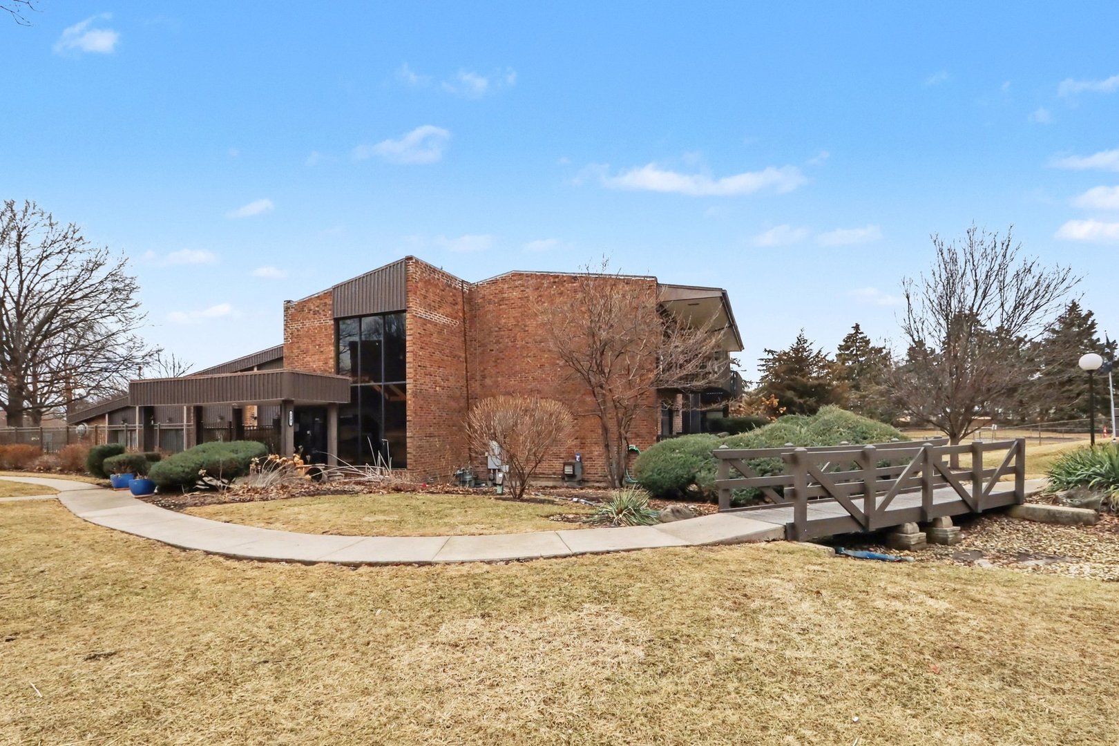 1423 Woodbridge Road, Unit 1E Joliet, IL 60436 - Photo 26 of 30 a view of houses with a yard