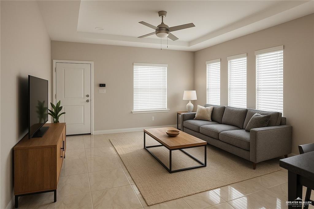 616 Mountain Road, Unit 5A Mission, TX 78573 - Photo 2 of 9 a living room with furniture and a flat screen tv