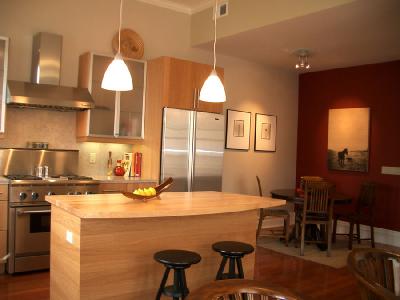 Kitchen Opens to Dinign Area in Upper Unit