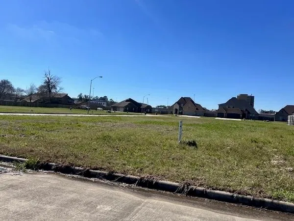 a view of a lake with a big yard