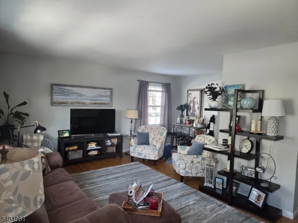 a kitchen with a refrigerator and a sink