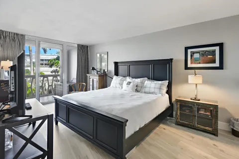 a bed room with a bed and a tv