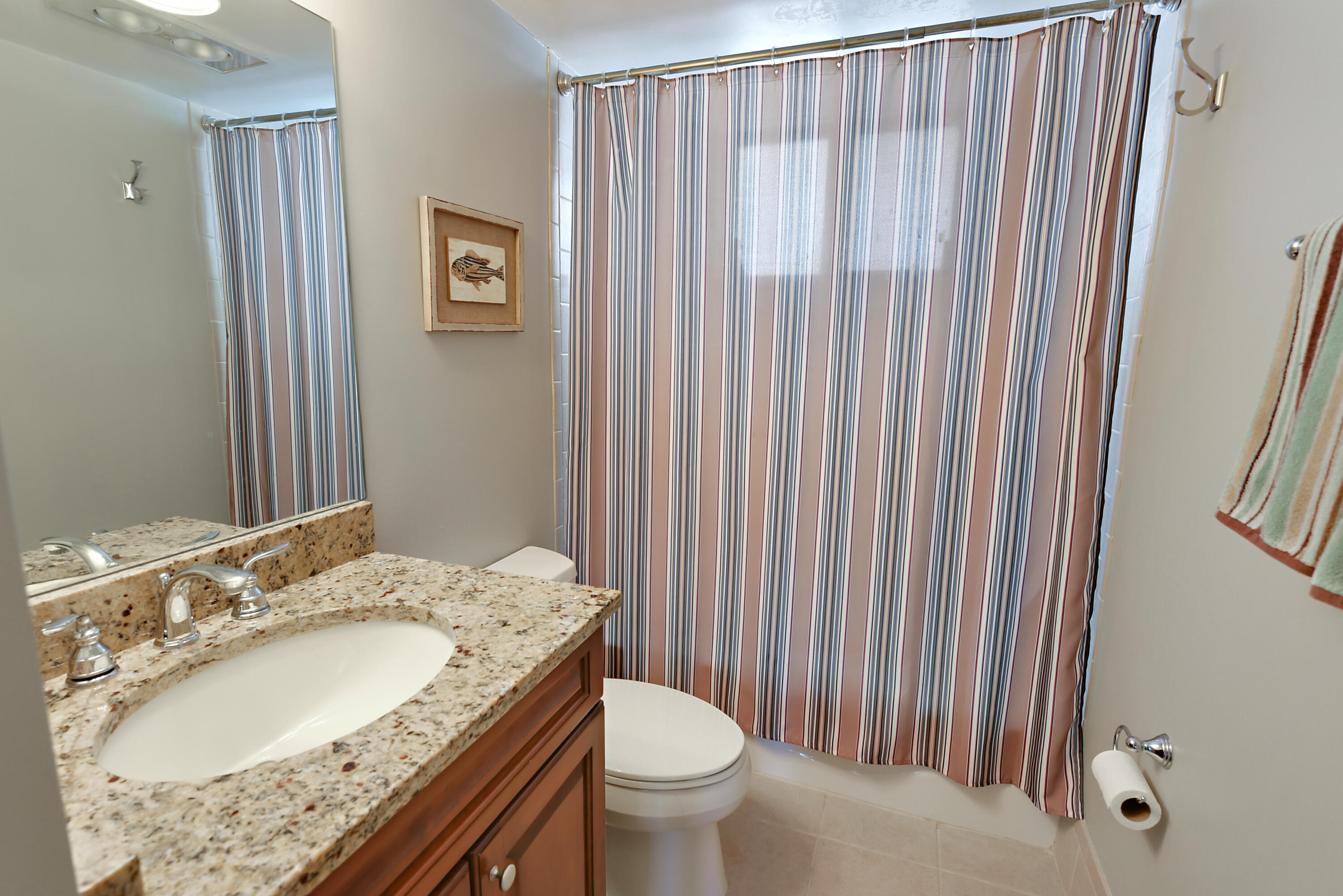 2505 South Ocean Boulevard, Unit 411 Palm Beach, FL 33480 - Photo 13 of 31 a bathroom with a granite countertop sink and a mirror