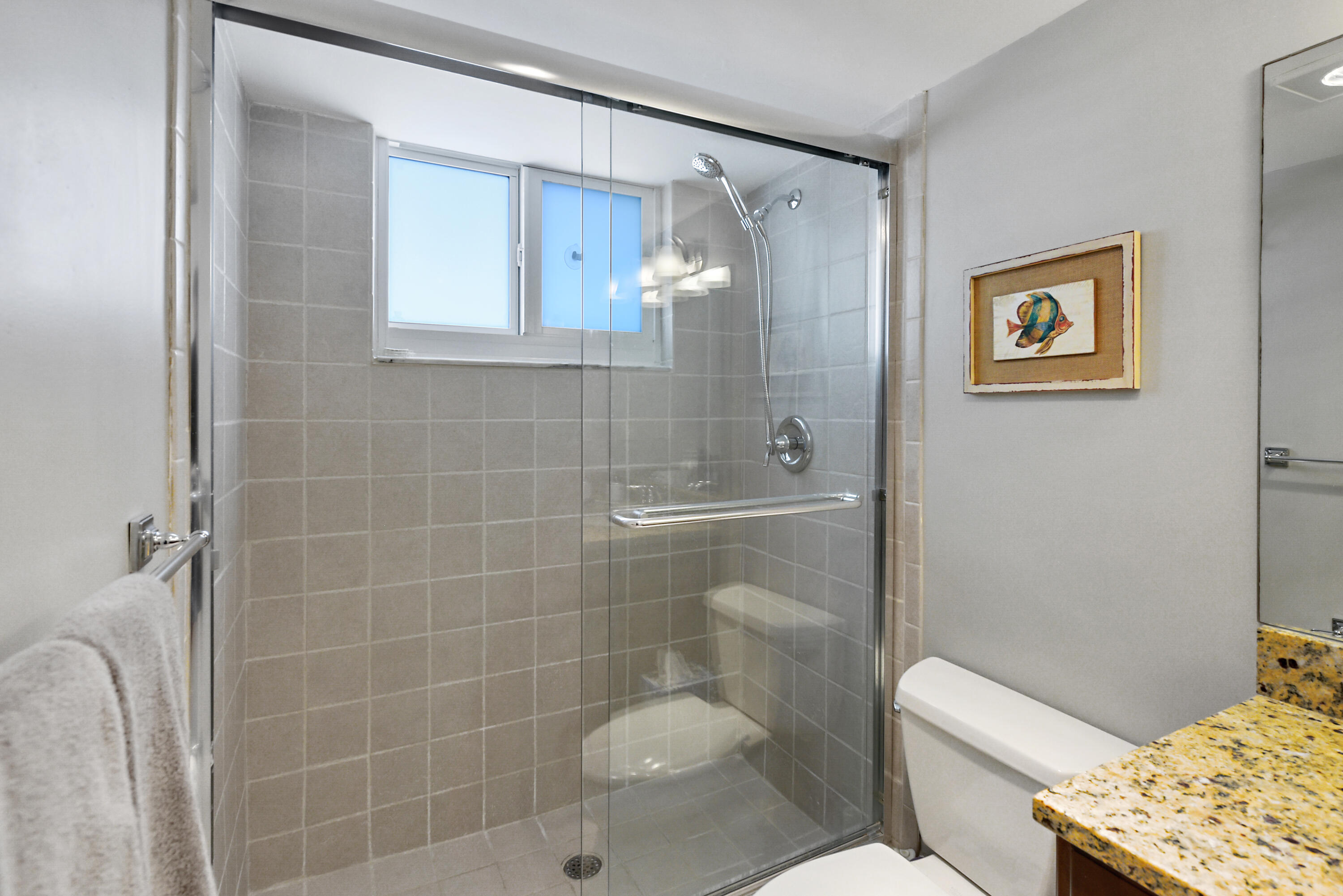 2505 South Ocean Boulevard, Unit 411 Palm Beach, FL 33480 - Photo 15 of 31 a bathroom with a toilet sink and shower