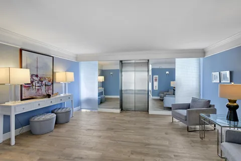 a large room with a table and chairs