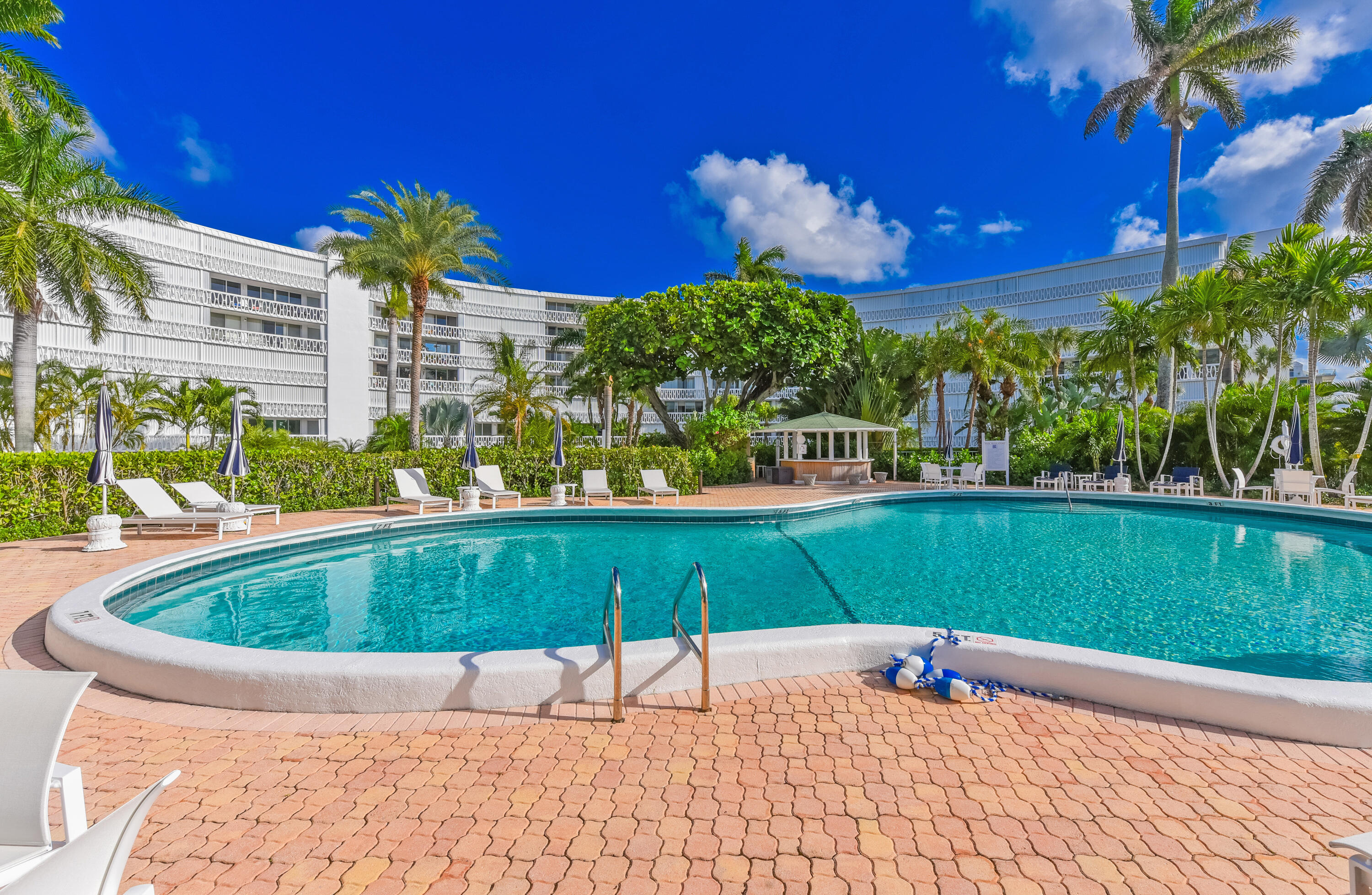 2505 South Ocean Boulevard, Unit 411 Palm Beach, FL 33480 - Photo 19 of 31 a view of a swimming pool with a patio