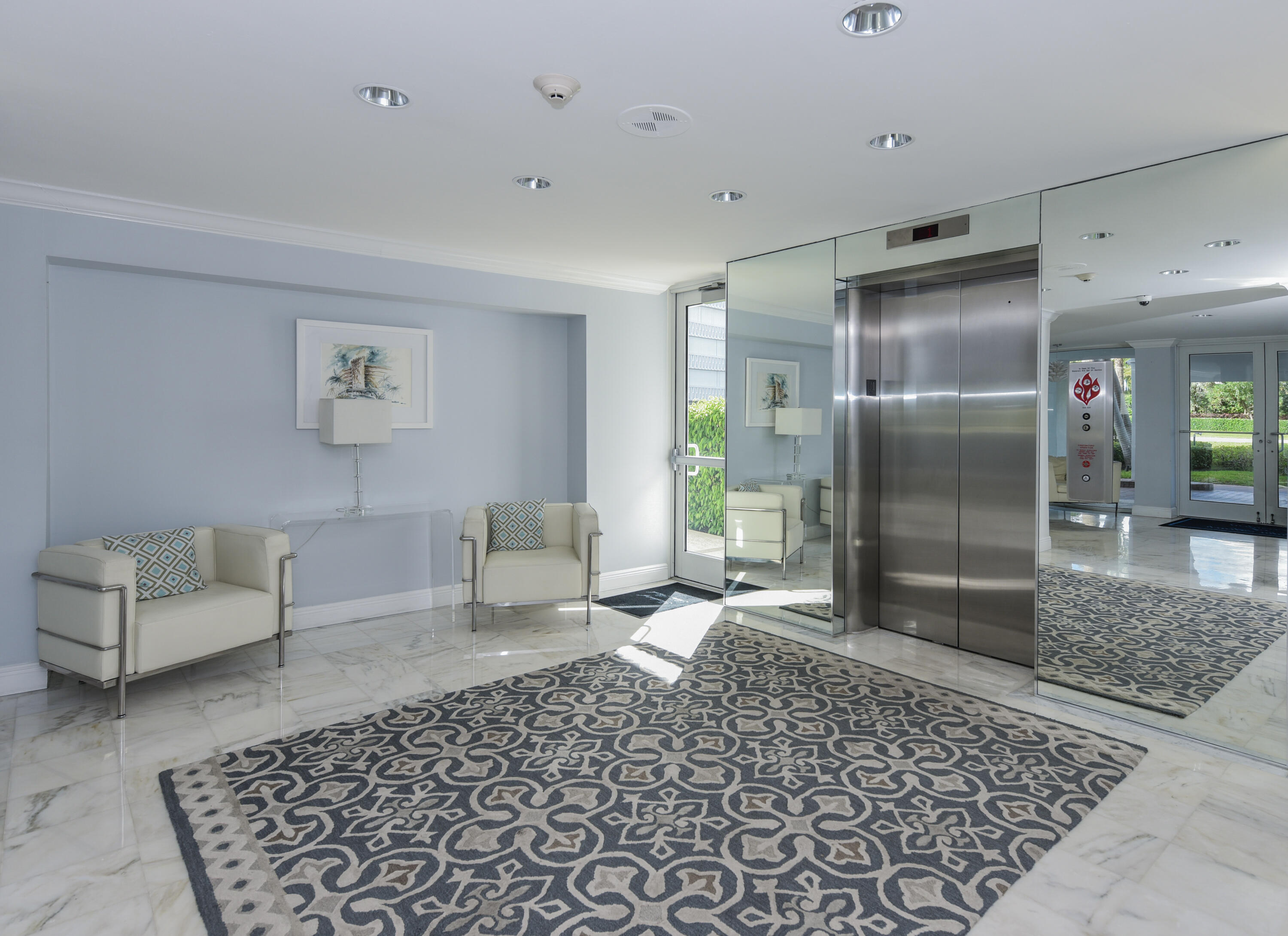 2505 South Ocean Boulevard, Unit 411 Palm Beach, FL 33480 - Photo 26 of 31 a living room with a couch