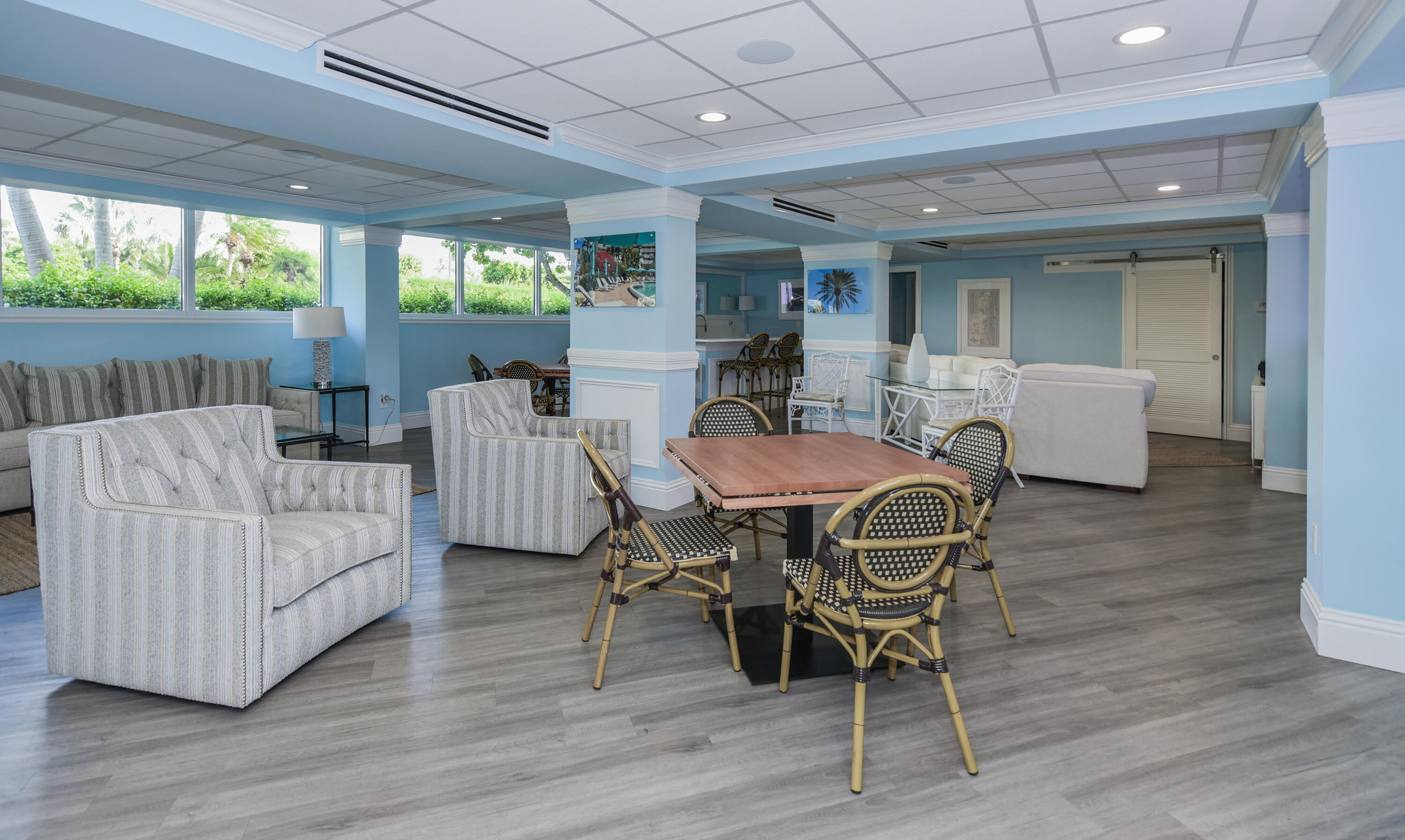 2505 South Ocean Boulevard, Unit 411 Palm Beach, FL 33480 - Photo 27 of 31 a dining room with furniture and wooden floor