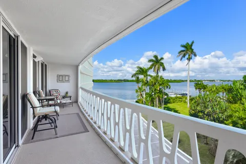 a view of a chairs and table in a balcony