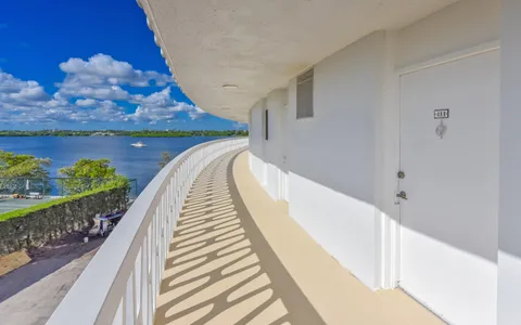 a view of a balcony with wooden floor