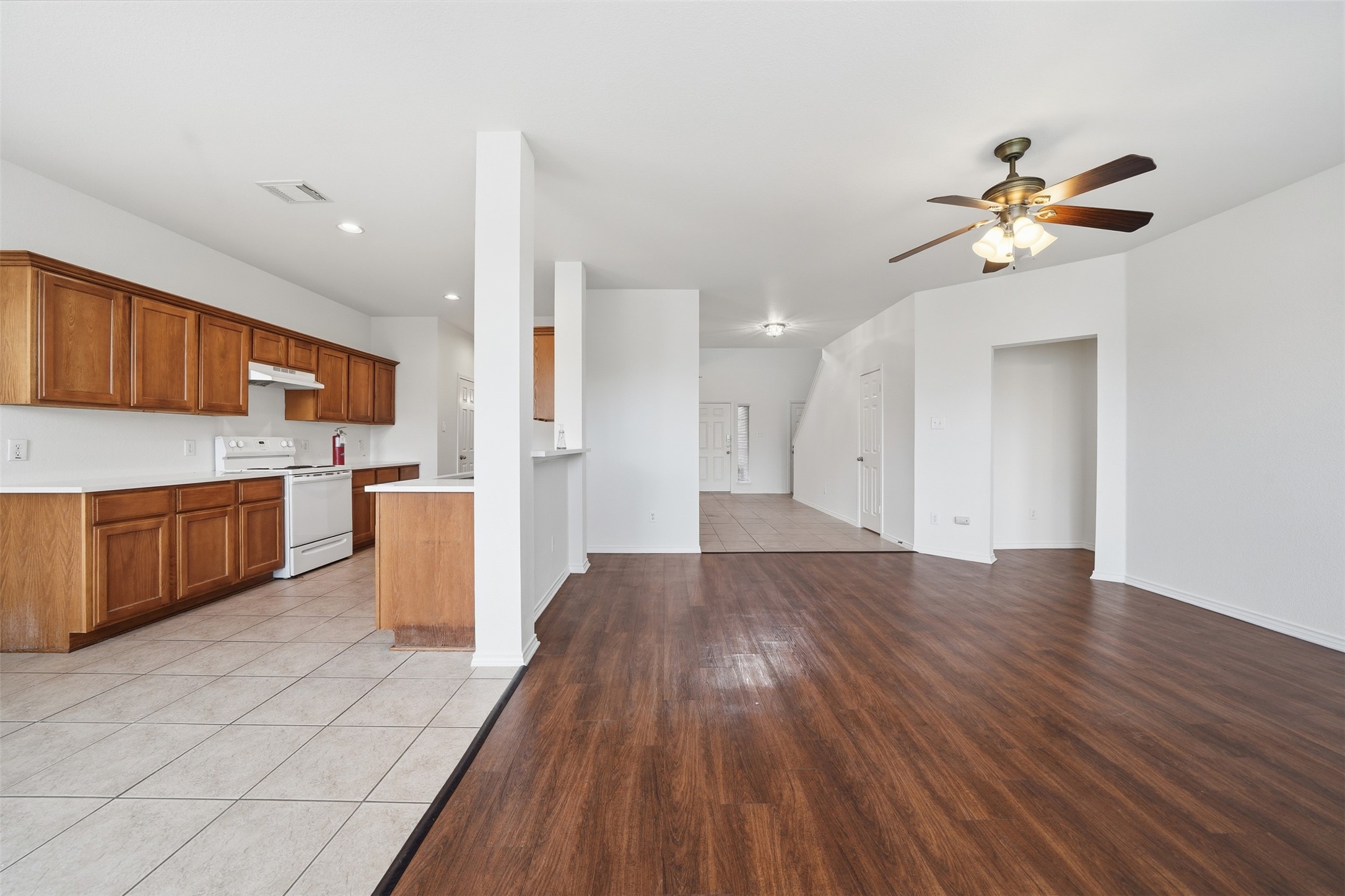 118 Invierno Street Kyle, TX 78640 - Photo 37 of 37 An open floorplan seamlessly connects the well-appointed kitchen to the spacious living area.