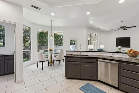 a kitchen with counter top space sink and stainless steel appliances