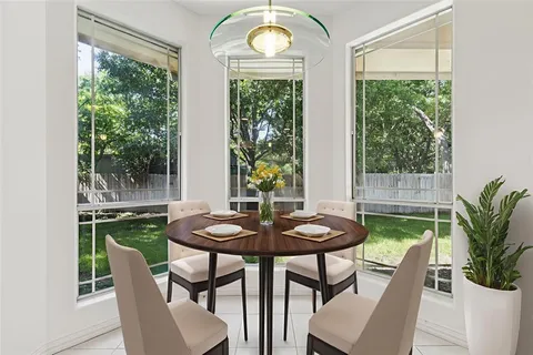 a view of a dining room with furniture window and outside view