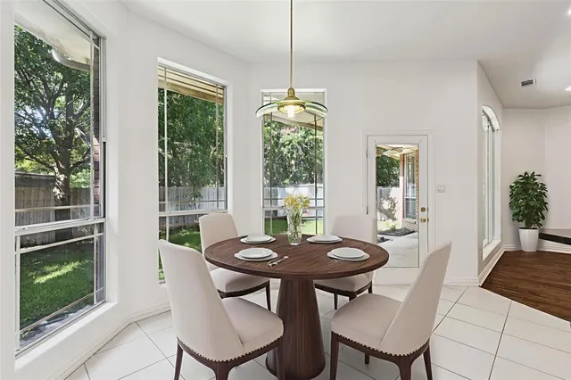 a view of a dining room with furniture window and outside view
