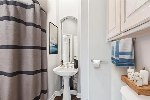 a bathroom with a sink a mirror and shower
