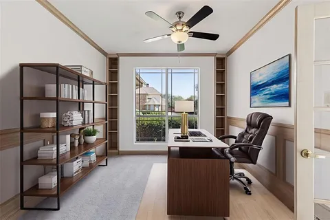 a livingroom with workspace and a window