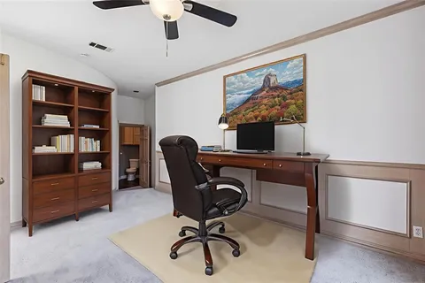 a view of a workspace with furniture