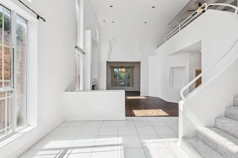 a view of entryway and hall with a couch