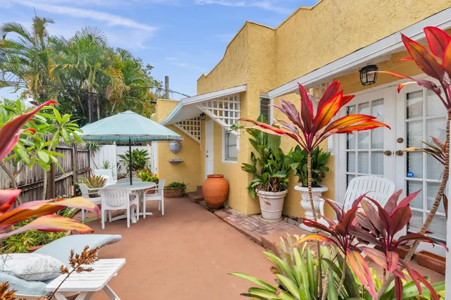 a view of a chairs and table in patio