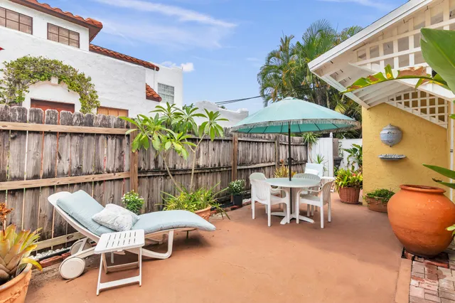 a patio with a table and chairs