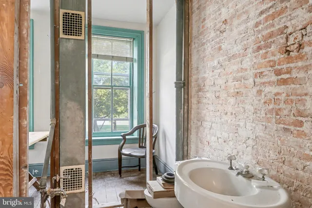 a bathroom with a sink a mirror and a shower