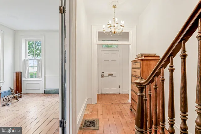 a very nice looking room with wooden floor and stairs