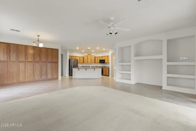 a view of a kitchen with a sink and a window