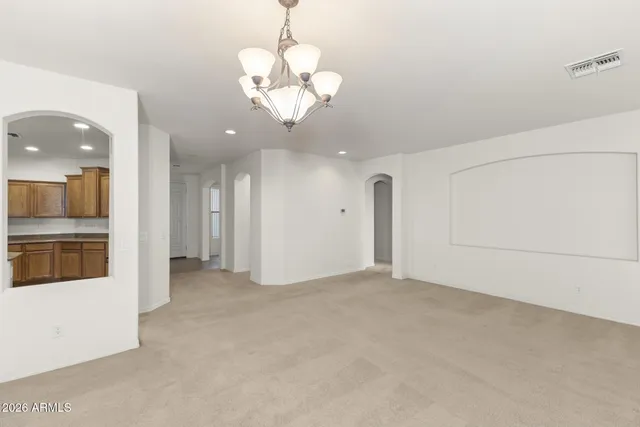 a view of a kitchen with a sink and a refrigerator