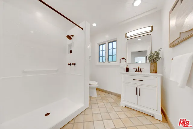 a bathroom with a bathtub sink and toilet
